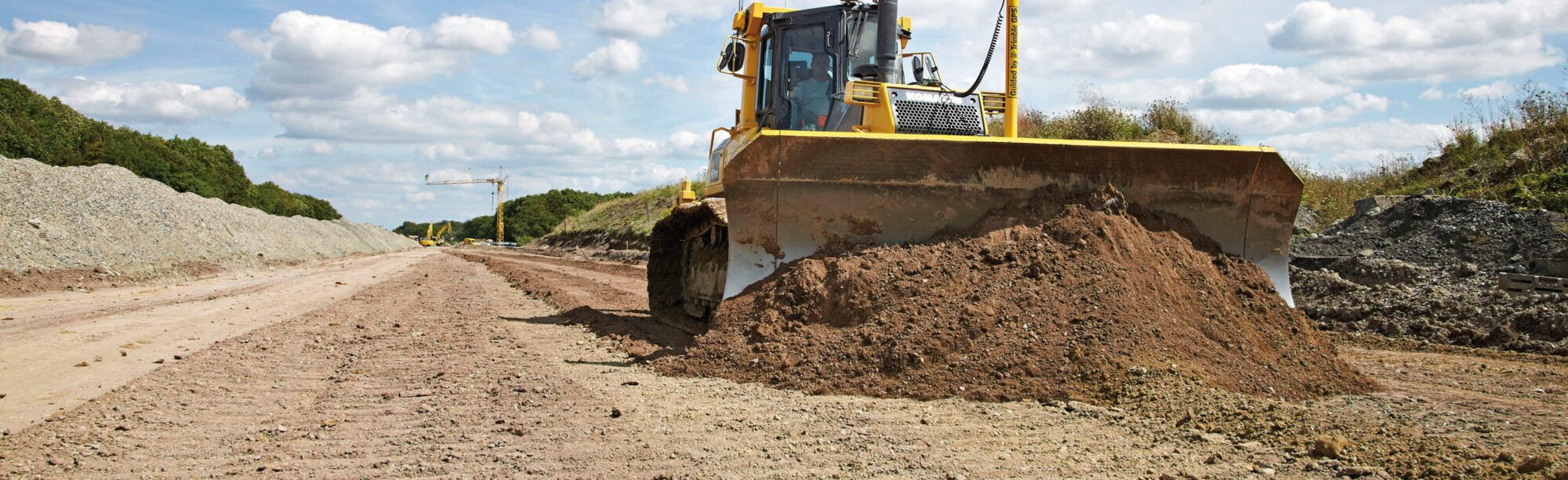 Vergaberechtliche Vorgaben für öffentliche Auftraggeber Straßenbau mit Baumaschine